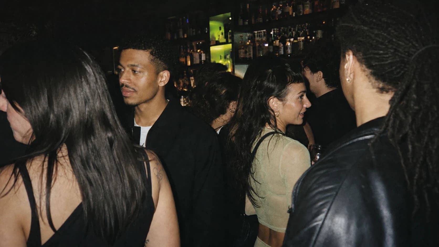 A candid crowd inside a low-lit Toronto bar